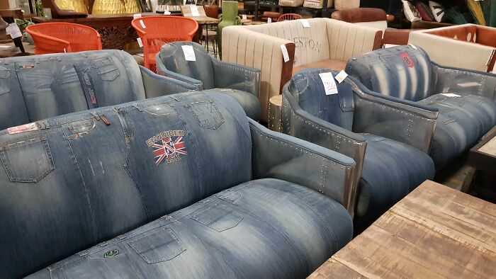 Sofas upholstered with denim fabric, resembling jeans, an example of bizarre furniture design.