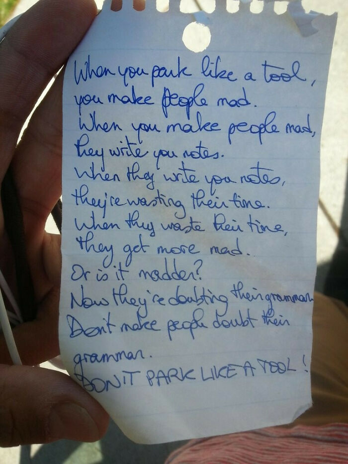 A handwritten note on a crumpled piece of paper criticizing outrageous parking with the phrase DON'T PARK LIKE A TOOL!