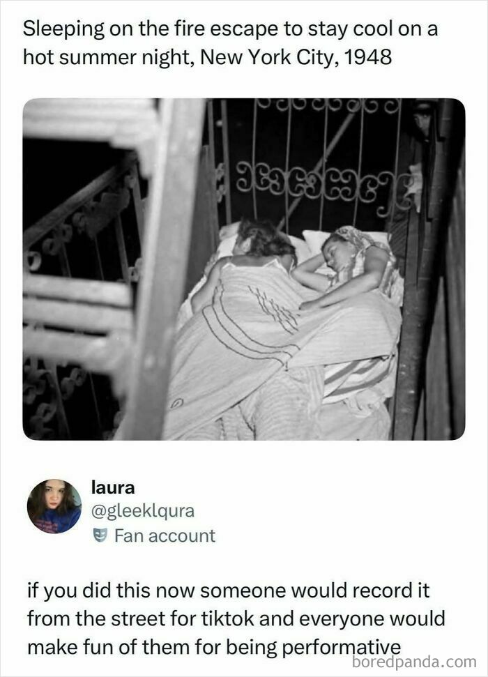 Black and white photo of two people sleeping on a fire escape in NYC, a viral moment from the internet.