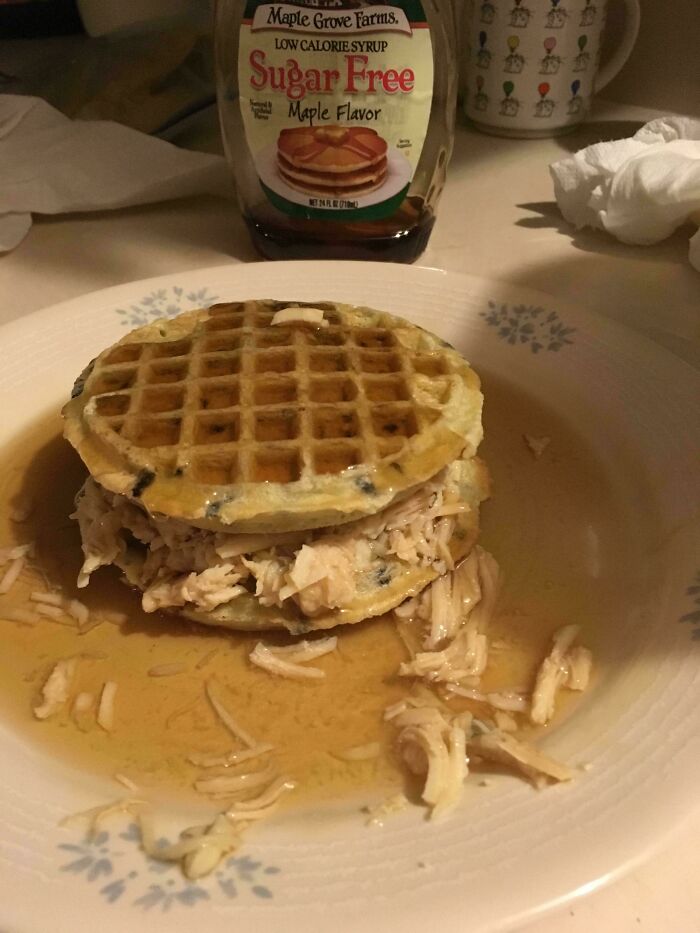 Waffles with shredded chicken and maple syrup, a bizarre and potentially disgusting food pairing.