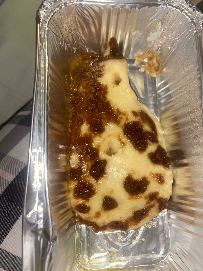 A close-up of a pear-shaped dessert with brown caramel spots, an example of stupid and disgusting food.