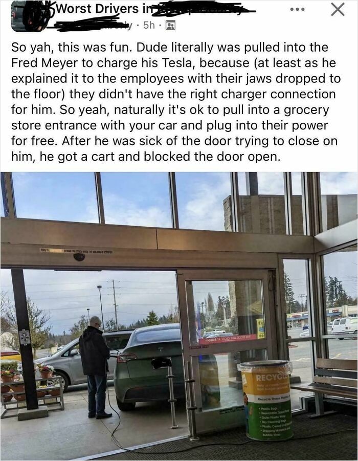 A car outrageously parked at a store entrance, charging its electric vehicle, blocking the sliding doors.