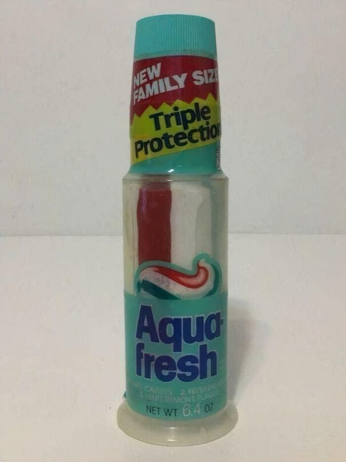 Aqua fresh toothpaste, a familiar sight for life in the 90s, offering triple protection in a family size.