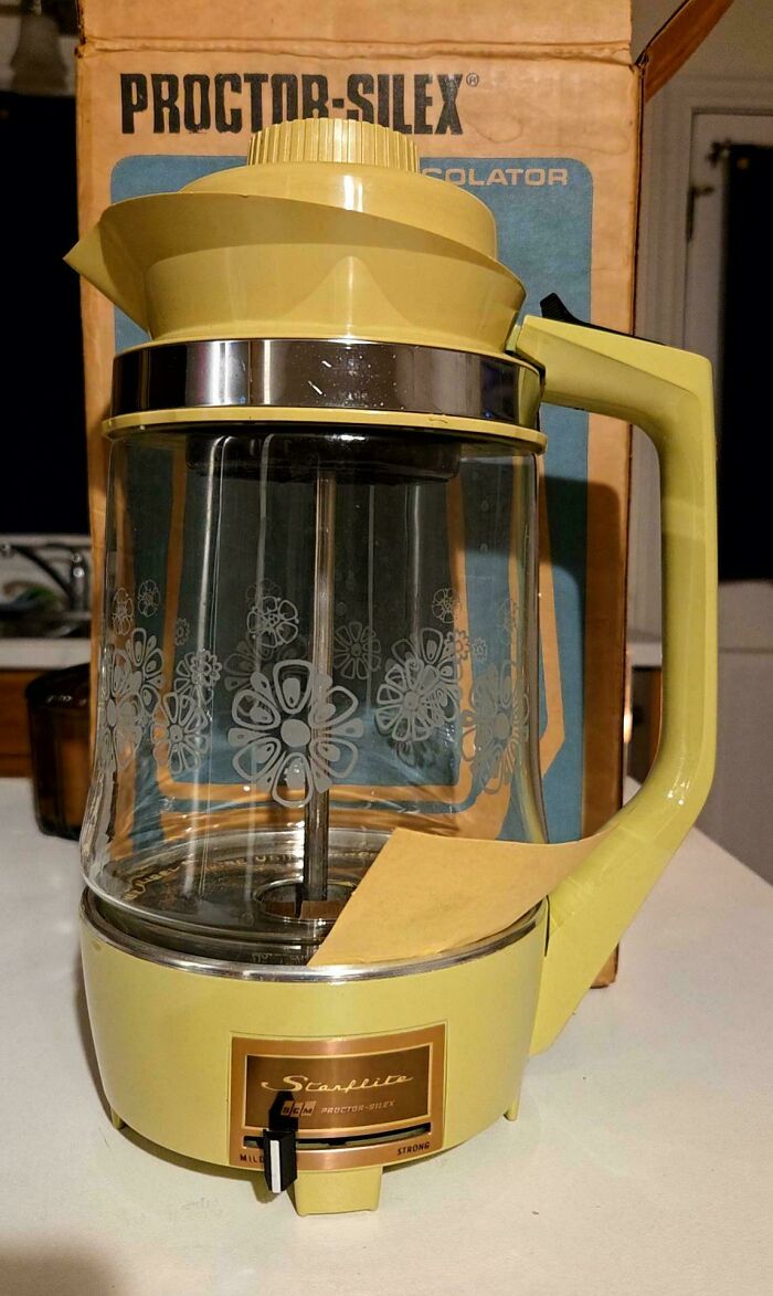 A retro yellow Proctor-Silex percolator, showcasing classic 1970s and 1980s interior design small appliances.