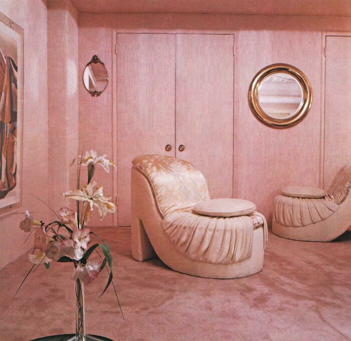 A plush pink room showcasing 1980s interior design with high-heel shaped chairs and floral arrangements, reflecting the best.