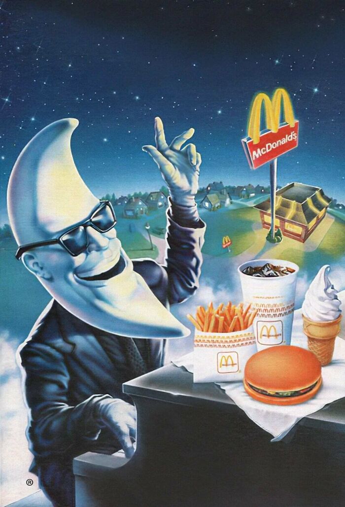 McDonalds Moon Man enjoying a meal, showcasing 1980s interior design and advertising art.