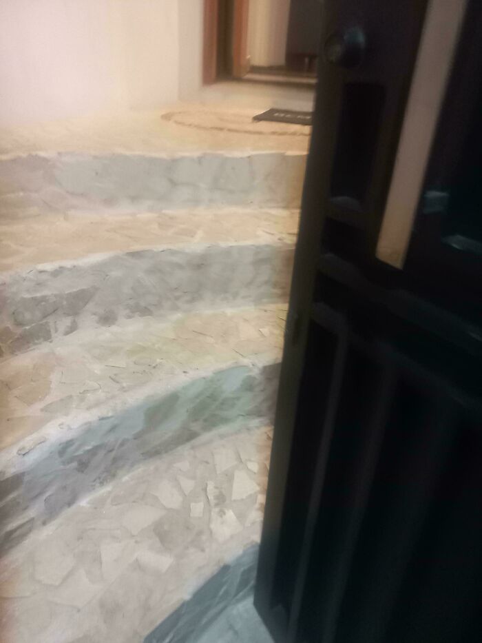 A construction fail, a staircase leads directly into a wall, demonstrating a significant design flaw.