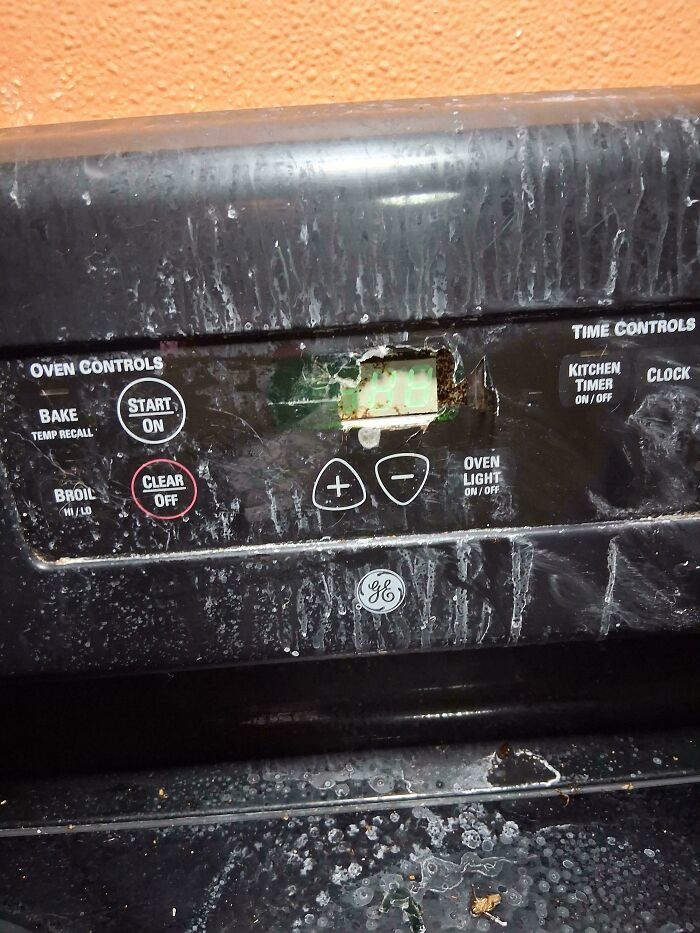 Dirty oven controls with a broken digital display, seeking help fixing things and finding answers to problems.