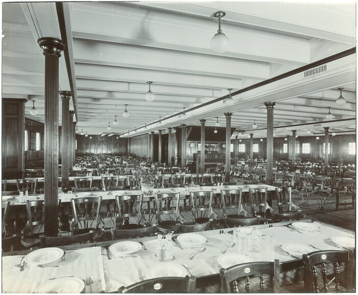 Historical photos showing an empty, grand dining hall with long tables and many chairs.