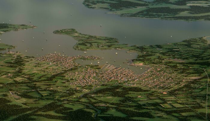 An aerial historical photo capturing a bustling port city with numerous ships on a large body of water.