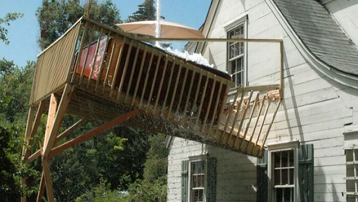 A hilariously collapsing deck, highlighting construction fails and poor craftsmanship.