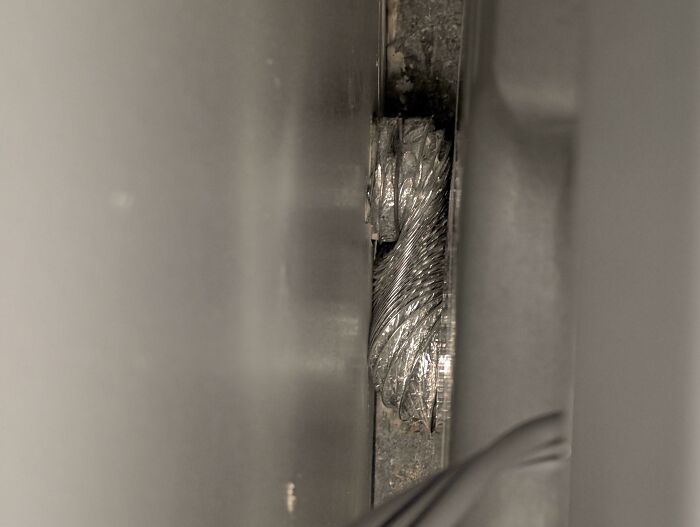 A damaged, twisted metal object, illustrating a problem people seek help fixing.