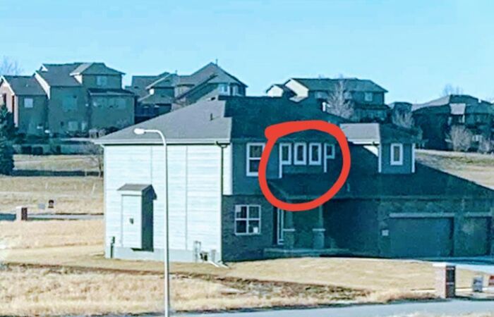 A house with the word p**p spelled out with window frames, an example of a construction fail.