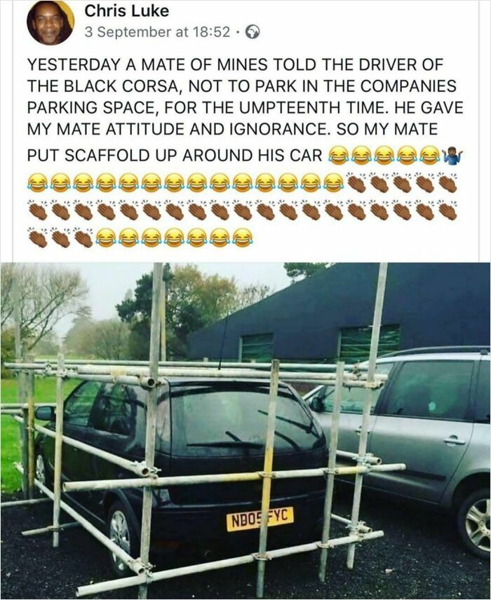 A black car surrounded by scaffolding, an impressive act of petty revenge for parking in a reserved spot.