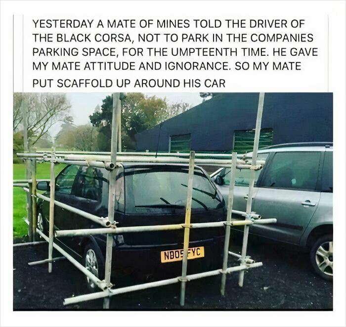 A black car parked badly, surrounded by scaffolding, showing a driver with a bad license and poor parking skills.