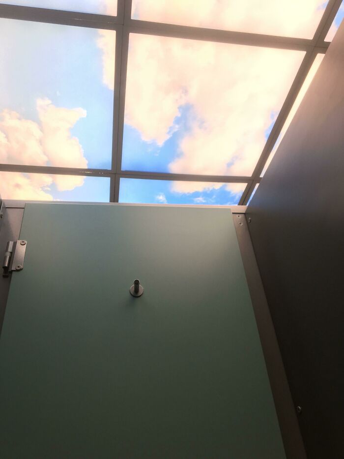 A brilliant sky-themed ceiling design in a restroom, transforming an ordinary space into an enjoyable view.