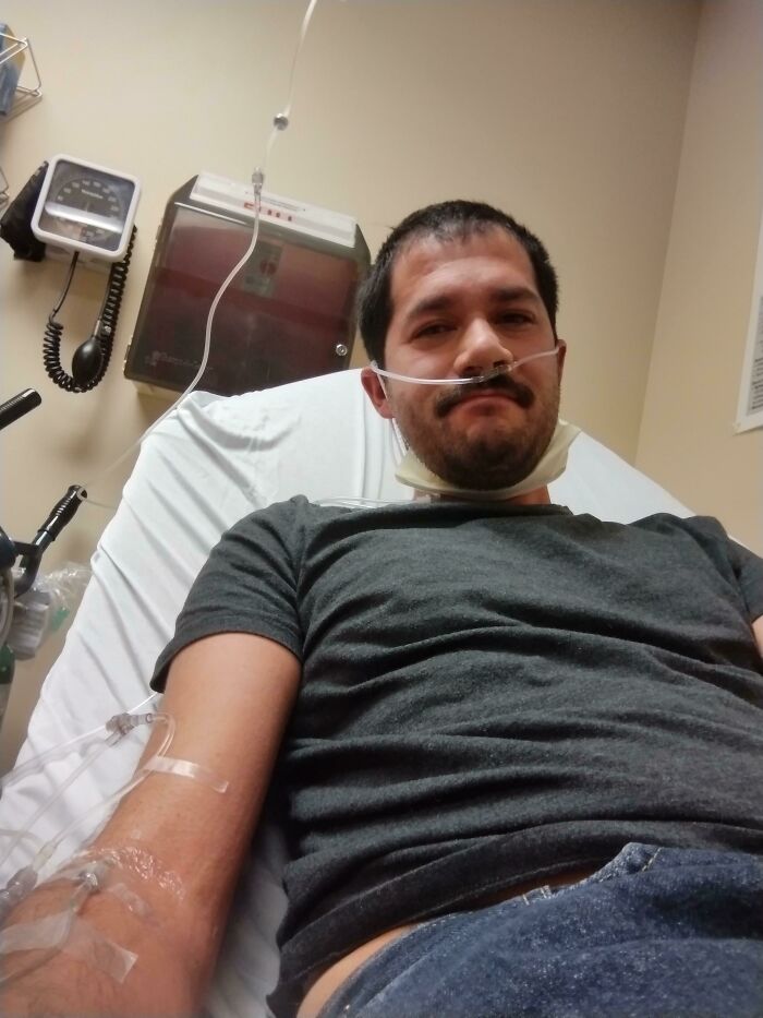 A man in a hospital bed with an IV and nasal cannula, illustrating someone having a worse day.