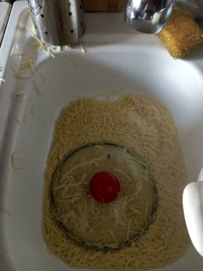 A kitchen sink full of uncooked noodles. Someone is having a worse day.