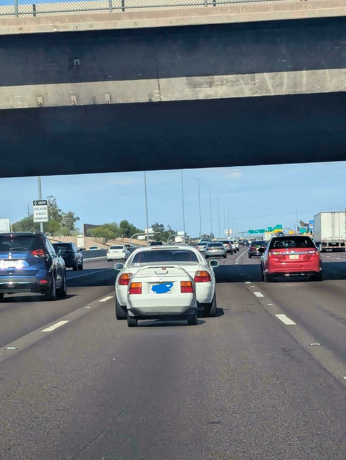 Brilliantly transformed ordinary car to transport a bicycle on the highway, showing clever design.