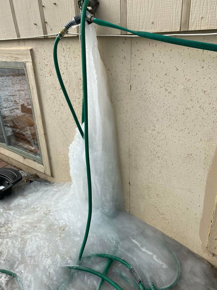 A massive block of ice has formed from a burst outdoor water pipe, making for a way worse day.