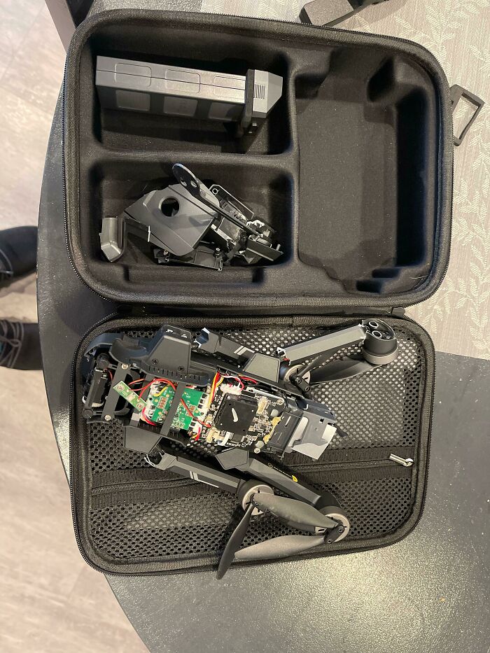 A disassembled drone in its carrying case, showing a worse day for electronics.