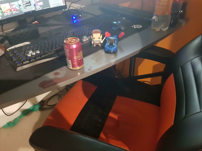An overturned drink can spilled on a desk, a scene from 87 People Who Are Having A Way Worse Day Than You.