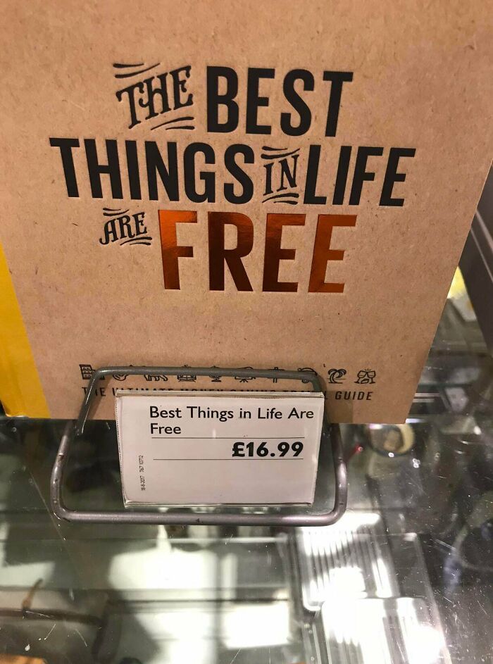 A hilariously failed sign for a book titled The Best Things in Life Are Free, with a price tag of £16.99.