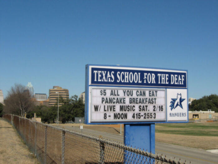 A hilariously failed sign at Texas School for the Deaf advertises a pancake breakfast with live music.