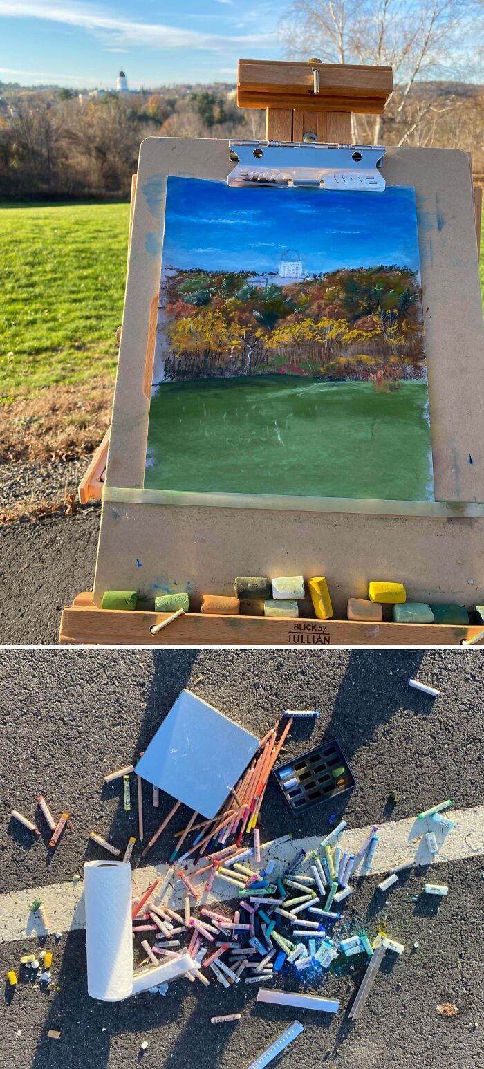 A painting on an easel with scattered pastels on the ground below, signifying a challenging day.