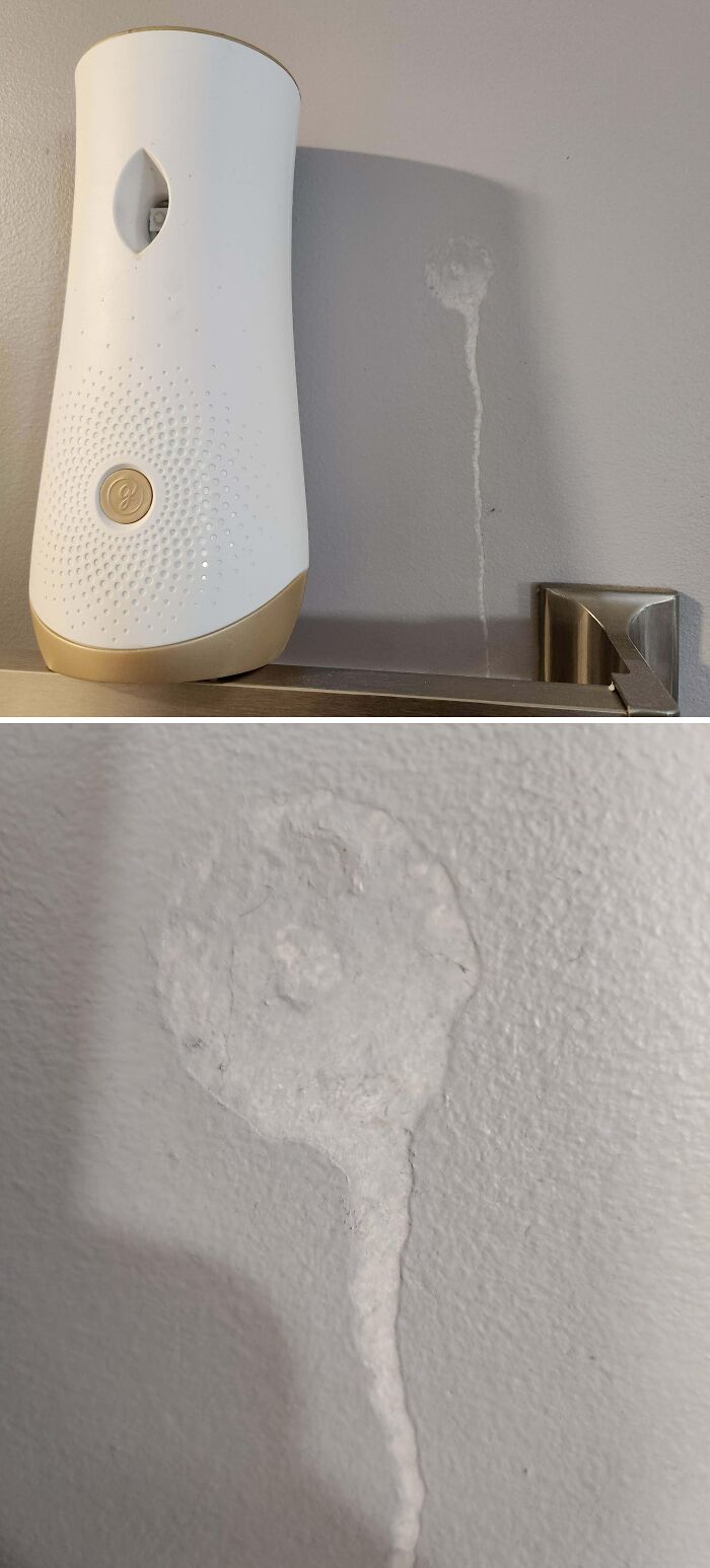 An automatic air freshener creating a streaky mess on a wall, depicting a way worse day.