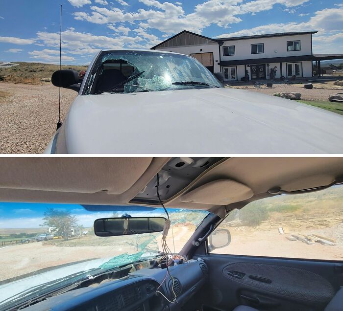 A shattered car windshield and damaged interior from a bad day.