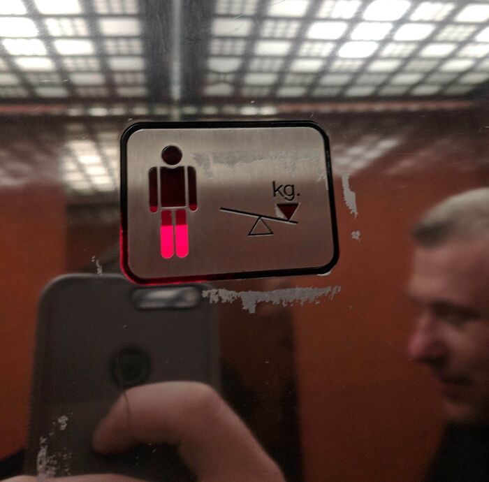 An elevator weight indicator transformed with a brilliant red light for overload, an enjoyable design.