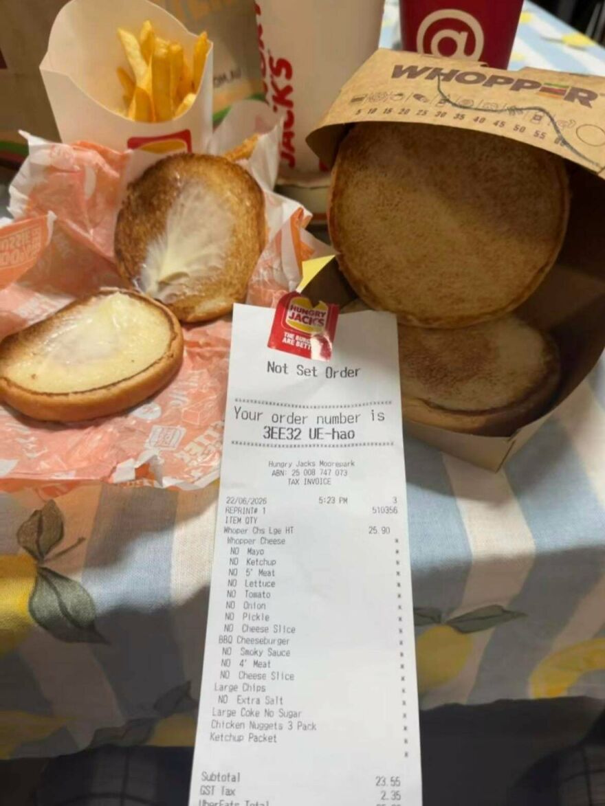 An expensive mistake: a fast food order showing an empty burger bun, missing the patty.