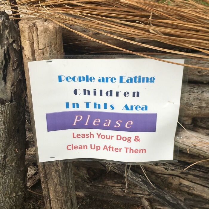 An awful design fail on a sign reading: People are Eating Children In This Area Please Leash Your Dog & Clean Up After Them.