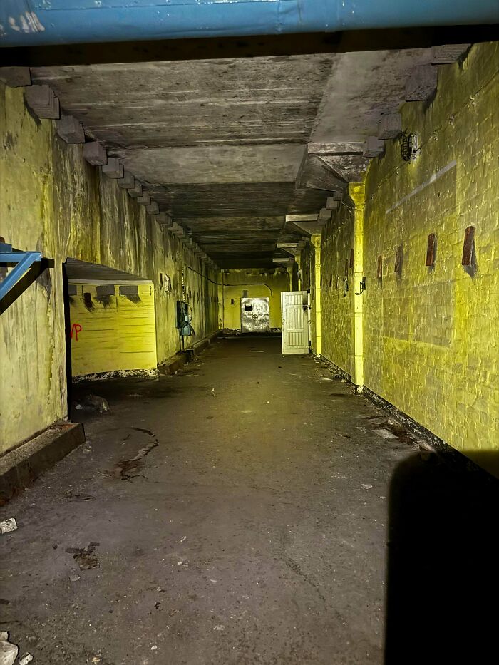 Urban explorers discovered a long, eerie, yellow-painted corridor in an abandoned building.