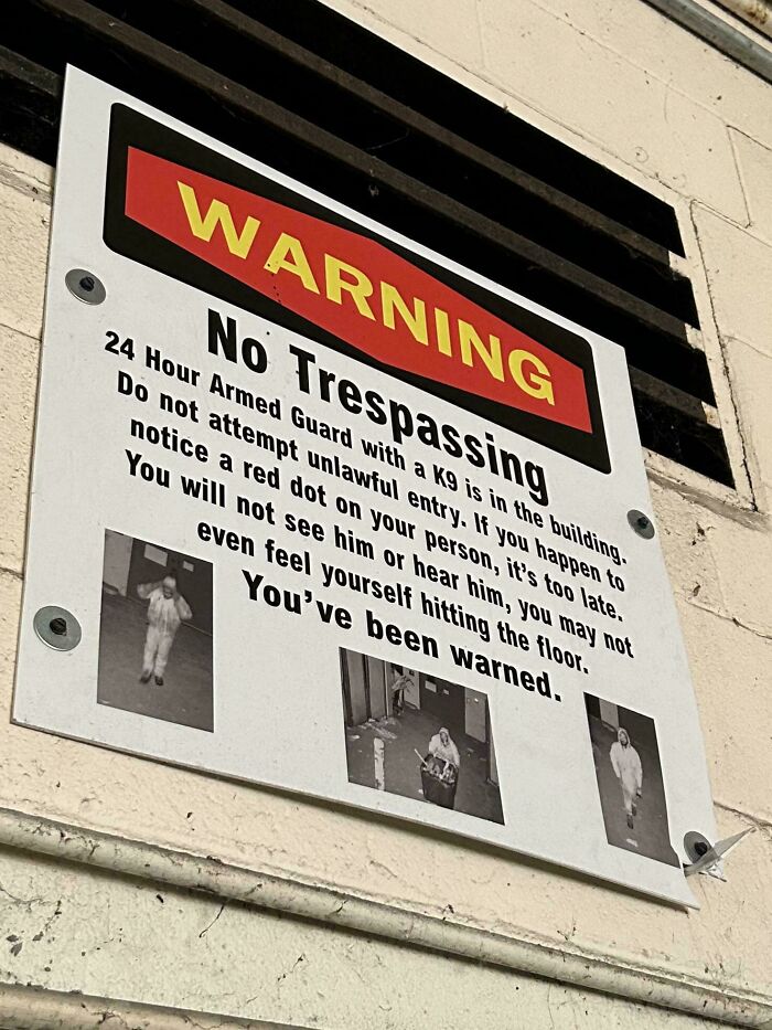 Urban explorers encountered a warning sign with security camera images in an unexpected location.