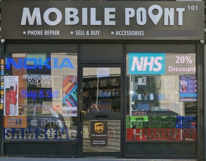 A hilariously awful design fail on a mobile phone shop sign, with Mobile Point accidentally spelled as Mobile Poont.