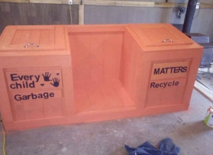 A poorly designed waste bin with 'Every child Garbage' and 'MATTERS Recycle' labels. An example of design fails.