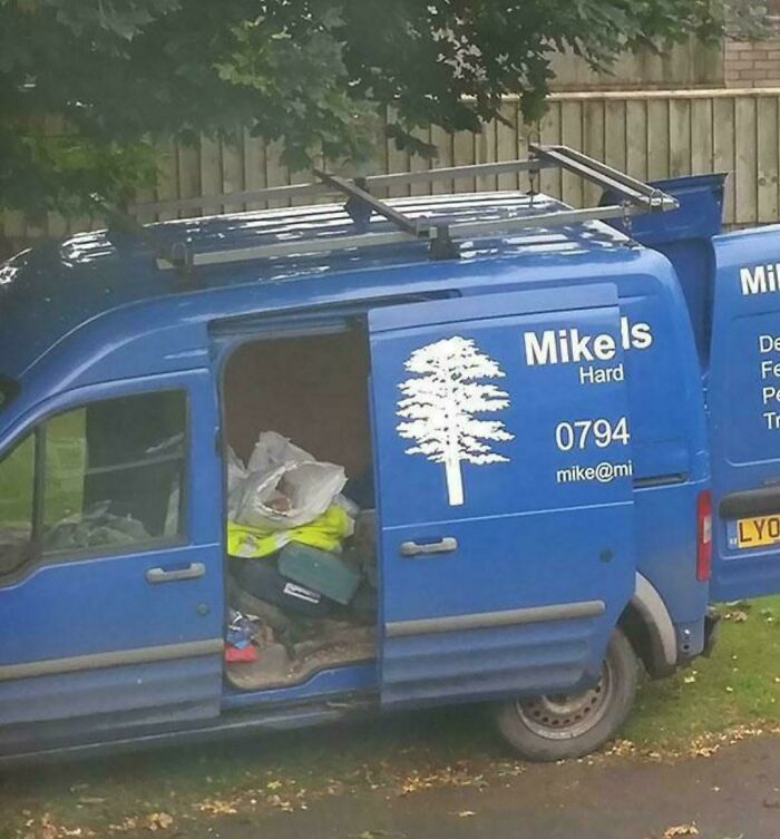 A blue van with a tree logo and text 'Mike is Hard,' an example of awful design fails.