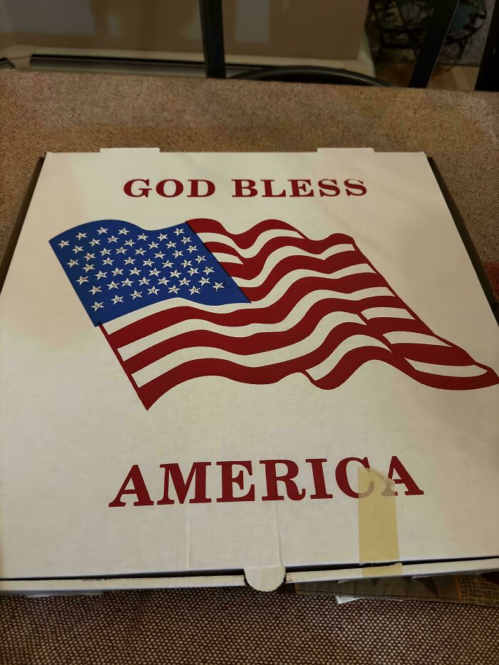 A pizza box with an American flag and God Bless America, a hilariously awful design fail.