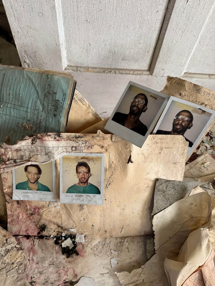 Urban explorers stumbled upon old photos and documents in a decaying room.