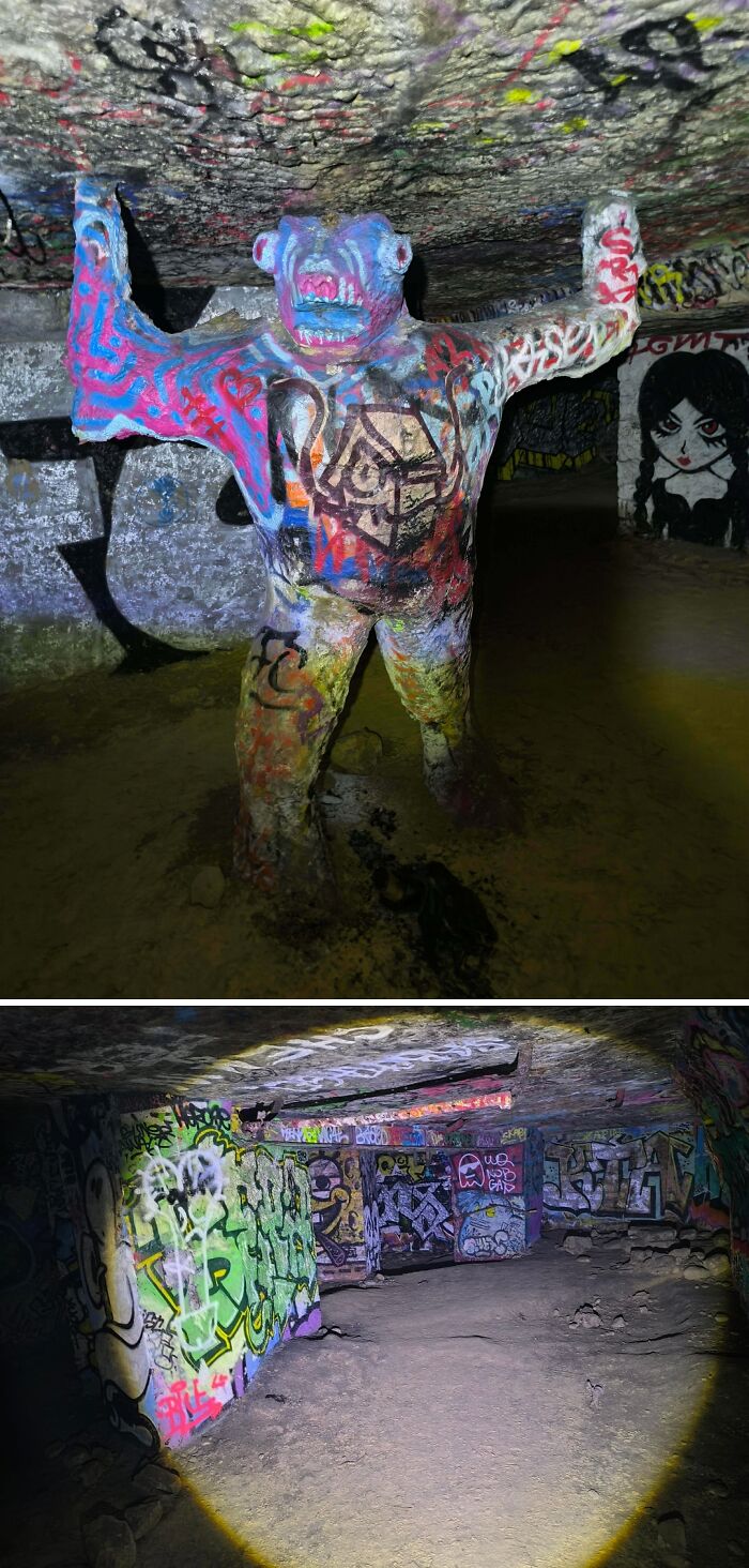 Urban explorers stumbled upon an unexpected, graffiti-covered statue in a brightly illuminated, underground tunnel.