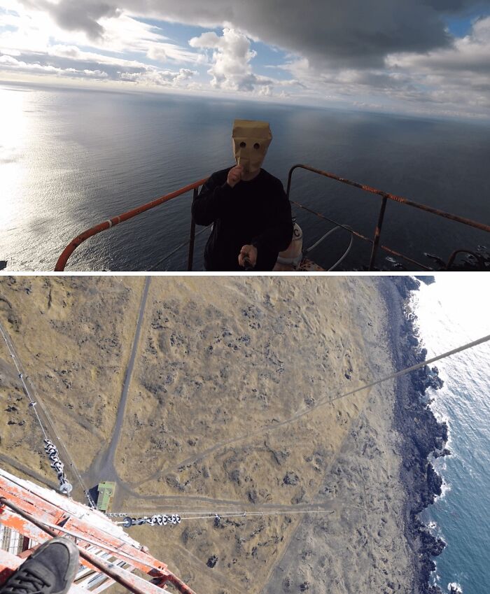 Urban explorers on a high tower overlooking the sea and land, finding unexpected views and a person with a paper bag on their head.