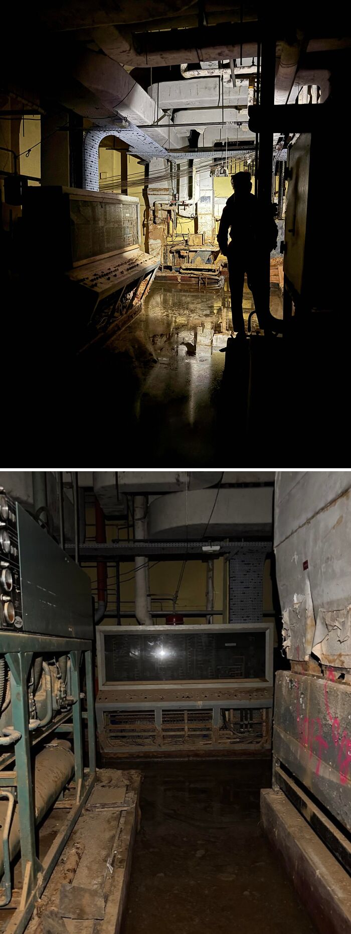 Urban explorers exploring a dark, wet, industrial-looking underground area with a silhouette.