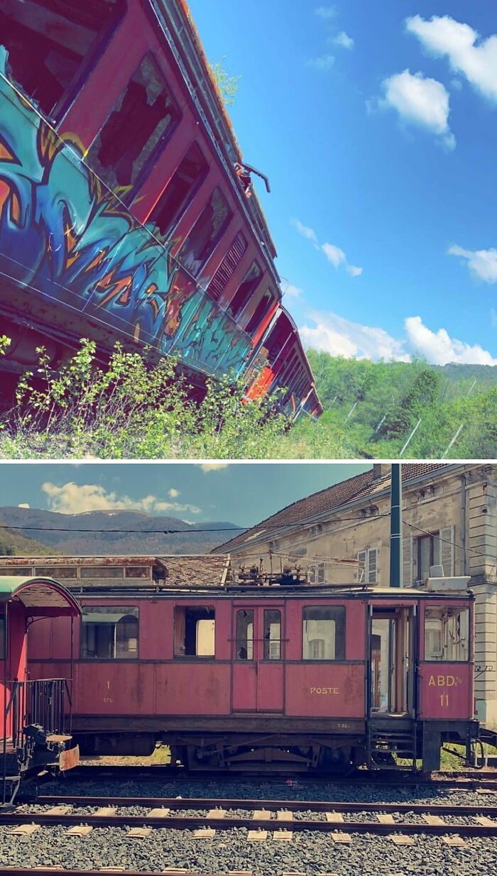 Urban explorers found an abandoned red train carriage covered in graffiti with a scenic background.