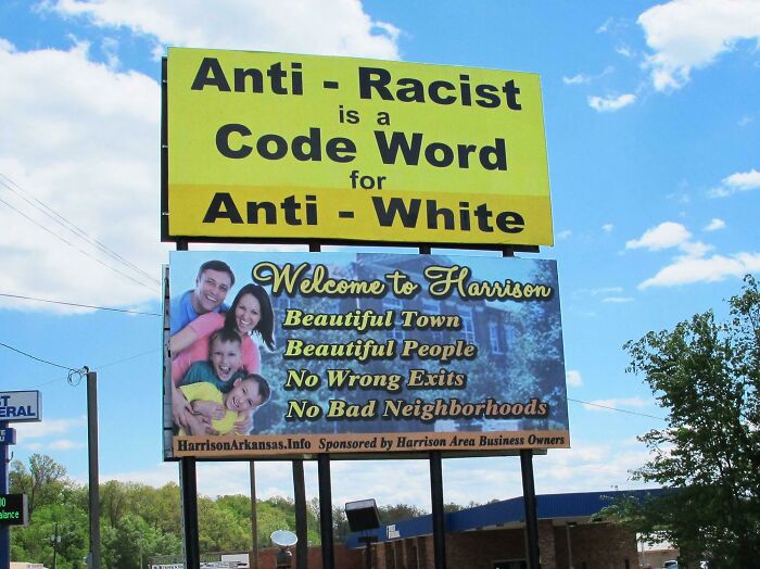 Two billboards in the USA, one with an anti-racist message and another welcoming to Harrison, showing different USA perspectives.