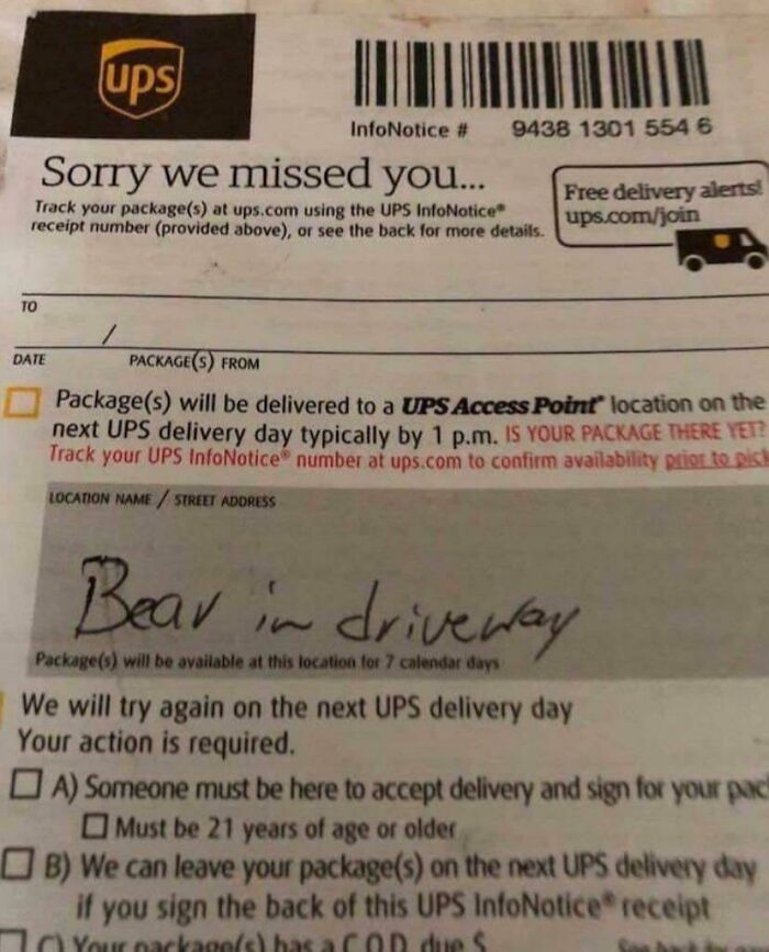 Photos of the USA: A UPS delivery notice with a handwritten message: Bear in driveway.