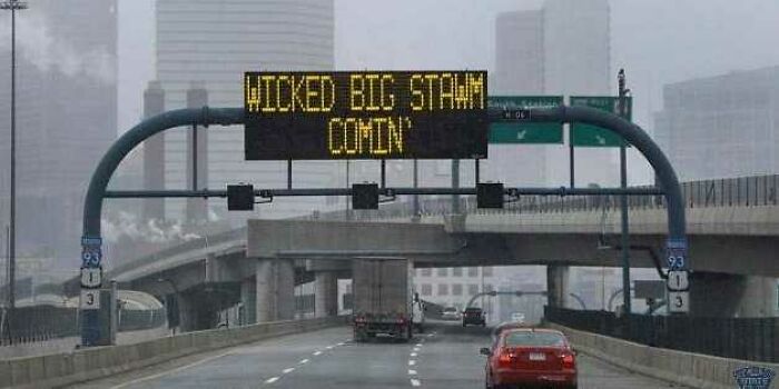 A highway sign displaying Wicked Big Stawm Comin', illustrating the wildly different cultural expressions in the USA.