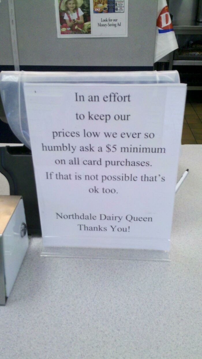 A sign at a Dairy Queen requesting a $5 minimum on card purchases, reflecting fascinating aspects of the USA.