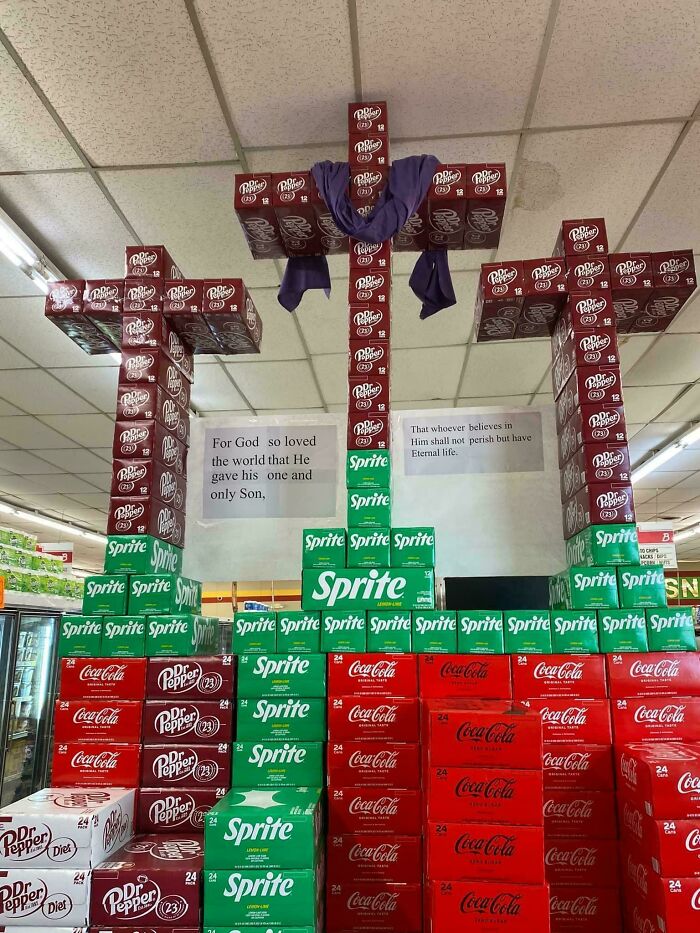 Wildly different photo of USA supermarket display, creating crosses from soda boxes, showing unique aspects of the country.